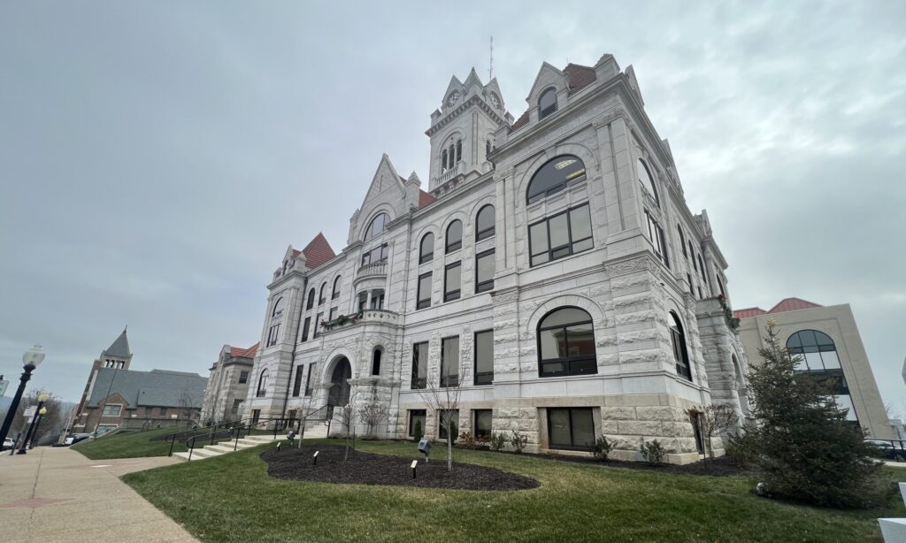 A stone government building on a cold, grey day